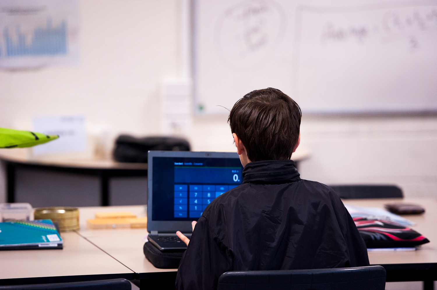 Boy doing maths at laptop